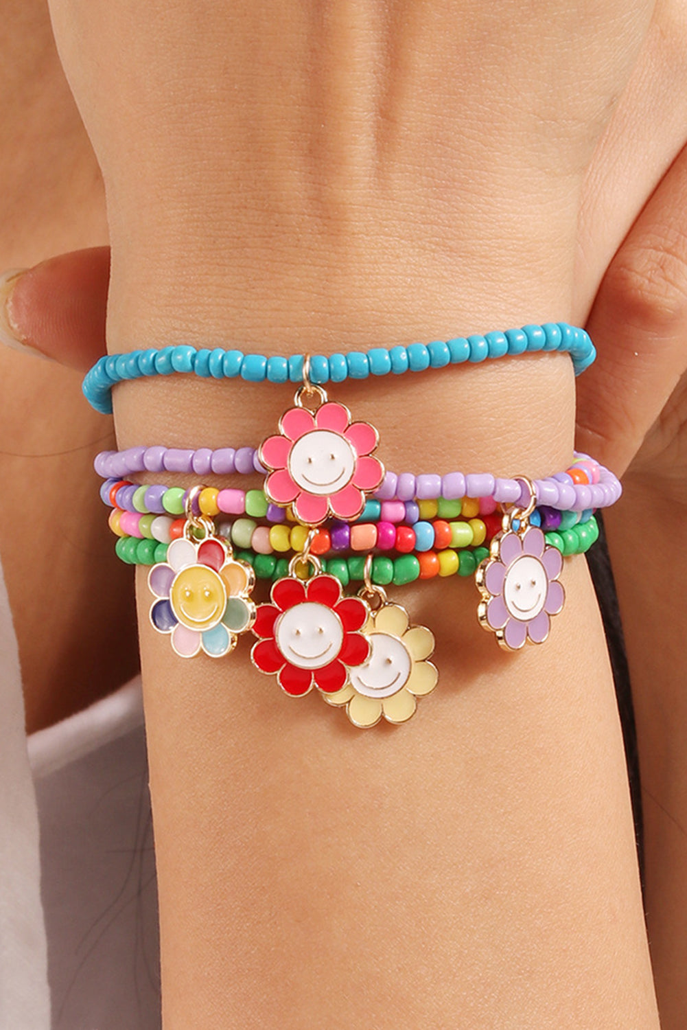 5 Piece Light Blue Smiling Flower Charm Bracelet Set